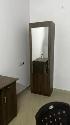 a bathroom with a sink and a mirror at Aneesh Arcade in Kollengode