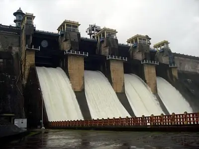 a large dam with water spilling out of it at Bean & Breeze in Suntikoppa