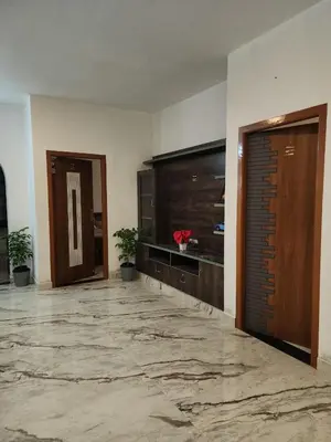 a lobby with a large room with a large door at Brooklyn Homestay in Vattavada
