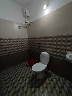 a bathroom with a toilet and a sink at Athirappilly resort villa in Athirappilly