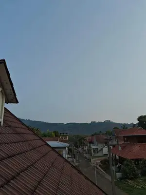 a view of a town with red roofs at Athirappilly resort villa in Athirappilly