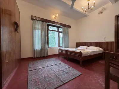 a bedroom with a bed and a window at Himalaya - 6bh Bunglow in Mysore