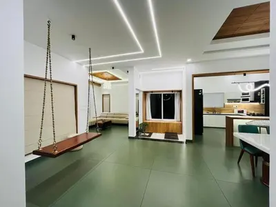 a kitchen and living room with a swing in it at Mistora Stays 2BHK Private villa in Kalpetta