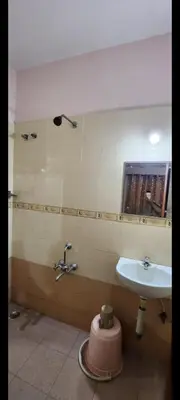 a bathroom with a sink and a sink at Deepam Homestay in Coimbatore