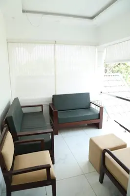 a living room with a couch and a table at Brand new 4 BHK luxury villa near kochi airport in Nedumbassery