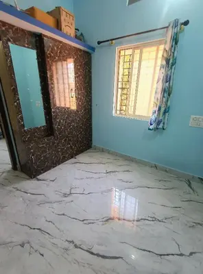 a room with a marble floor and a window at Affordable home stay in Chāmrājnagar