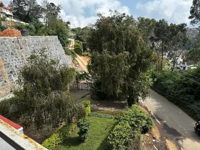 an overhead view of a garden with trees and bushes at Grays club guest House in Coonoor