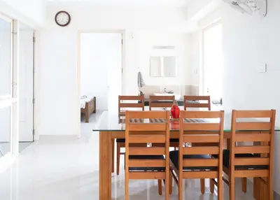 a dining room with a table and chairs at 2BHK with Pool and Rooftop at the Centre of Kozhikode in Kozhikode