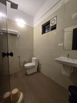 a bathroom with a toilet and a sink at Forest edge Villa - 3 bedrooms in Ambalavayal
