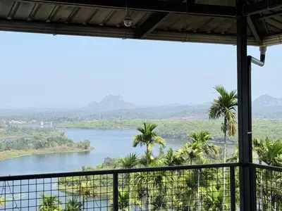 a view from a room with a view of a river at Valensa lake view in Kalpetta