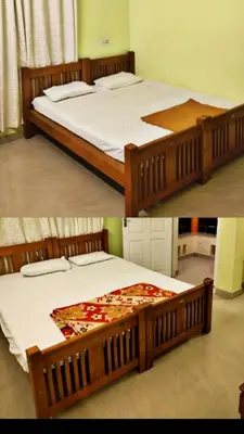 a couple of beds in a room at Dew drops Marayoor in Kanthalloor