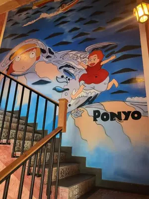 a mural on the stairs of a building at Ponyo Stays in Cochin