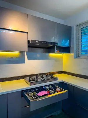 a kitchen with a stove top oven in a kitchen at White House, Managed By Triora Escapes in Maddūr
