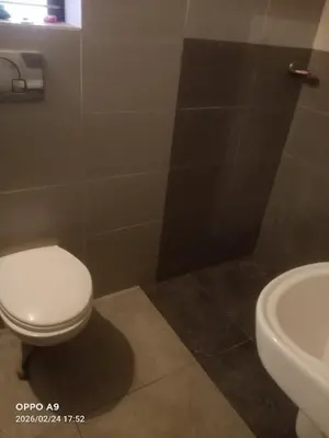 a bathroom with a toilet and a sink at Nalukettu Veedu in Thottada