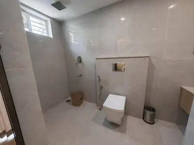 a bathroom with a toilet and a shower at The Zen Retreat in Kozhikode