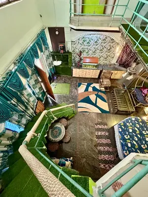 an overhead view of a room with colorful carpet at Mysore City Center Rooms by A1k in Mysore