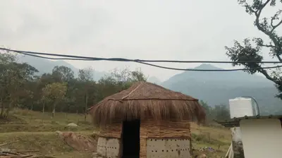 a small hut with a straw roof in a field at Haven heights kanthalloor in Kanthalloor