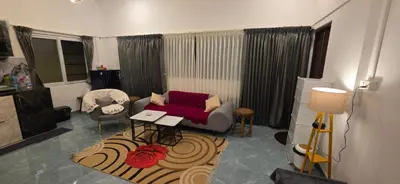 a living room with a couch and a table at SARA'S LUXURY stay in Coimbatore (Peelamedu)