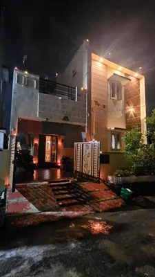 a house is lit up at night at BALS Villa in Tudiyalūr