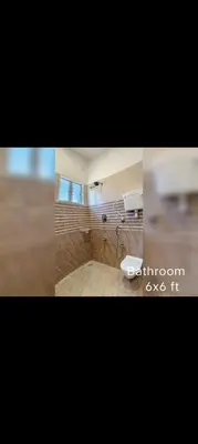 a picture of a bathroom with a sink at R N P Guest House in Pollāchi