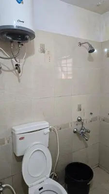 a bathroom with a toilet and a shower at Nakshatra individual villa in Ooty