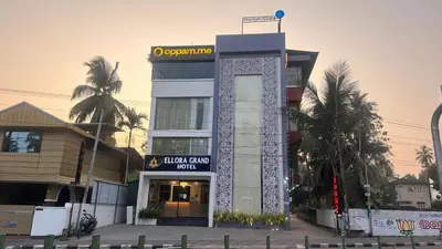 a building with a sign on top of it at Ellora grand hotel in Kozhikode