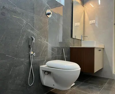 a bathroom with a toilet and a shower at Bison Trails Valley View Kothagiri Ooty Tamilnadu in Kotagiri