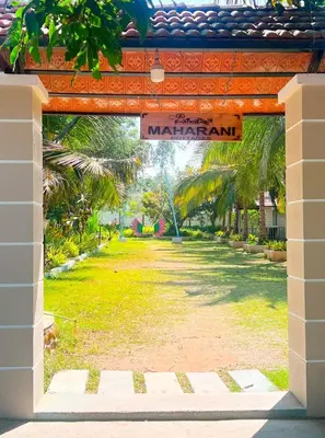 a gate to a park with a sign that reads mariani at Bombe Resort Channapatna in Channapatna