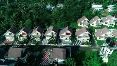 an overhead view of a group of houses with roofs at The NEST VILLAS in Athirappilly