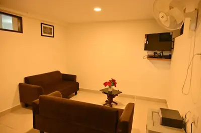 a living room with a couch and a table at Radisson in Madikeri