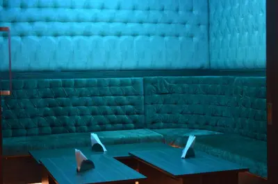a room with two tables with laptops on them at Kiscol Grands Hotel in Coimbatore