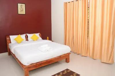 a bedroom with a bed and a curtain at Holidayincoorg Orchid Villa in Madikeri