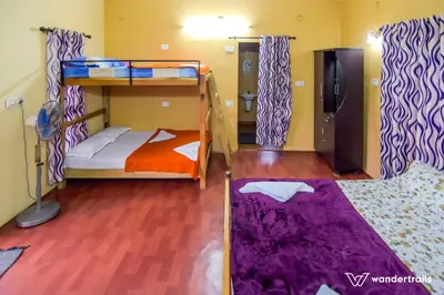 a room with two bunk beds in it at Sahyadri Homestay wayanad in Kalpetta