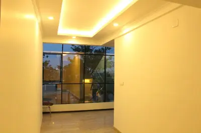 an empty hallway with a large window in a building at Ebenezer Plaza in Nedumbassery