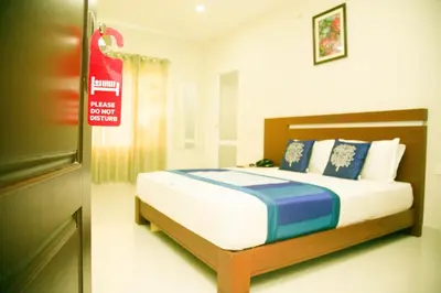 a bedroom with a large bed in a room at Dream Land Residency in Mananthavady