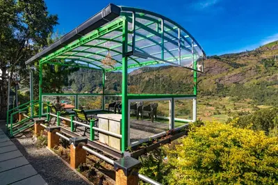 a green structure with animals in a field at Castillo De Woods , The Private Luxury Villa , 8 BHK, Vattavada in Kottakamboor