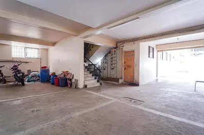 an empty room with a staircase in a house at FabHotel ESS Paradise in Coimbatore
