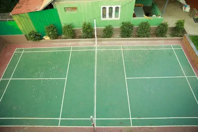 an overhead view of a tennis court in a house at Palm Era Resorts in Kushālnagar