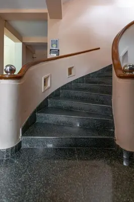 a set of stairs in a building at KSTDC Hotel Mayura Kauvery KRS in Hosa Kannambādi