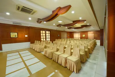 a large room with a bunch of chairs in it at Plaza Inn in Coimbatore
