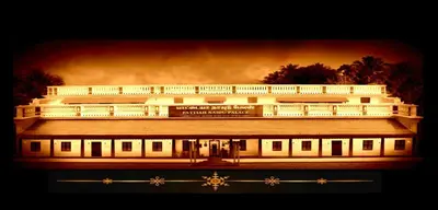 a cruise ship is lit up at night at Pattiah Naidu Palace in Palani