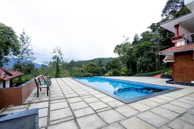 an image of a swimming pool in a house at Green Garden Jasmin Cottage in Vayittiri