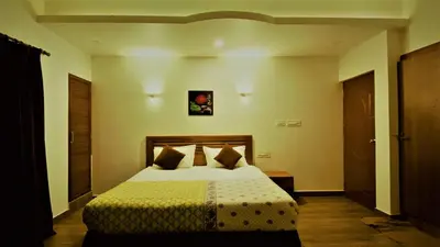a bedroom with a bed in a room at White Shell Beach House in Kannur