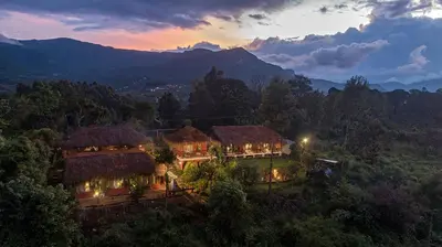 an aerial view of a house in the mountains at Deshadan Eco Valley Resort - An Eco friendly Mud House in Kanthalloor