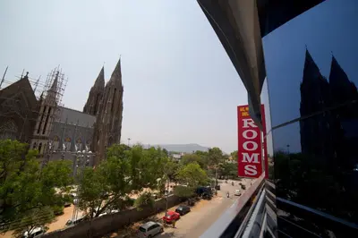 a view of a city street with a hotel sign at Aishwarya Le Royal in Mysore