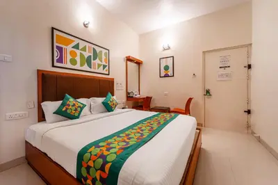 a bedroom with a large bed in a room at Treebo Sam Residency in Coimbatore