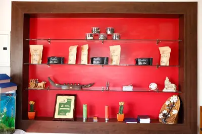 a red shelf with various items on it at Paradise Perfect - Nonsmoking Non alcoholic No unmarried couples in Ooty