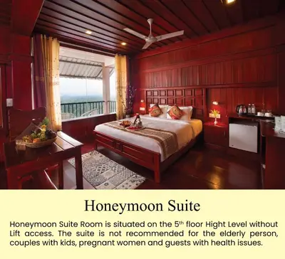 a room with a bed and a desk and a bed sidx sidx at Coorg Cliffs Resorts in Ammatti