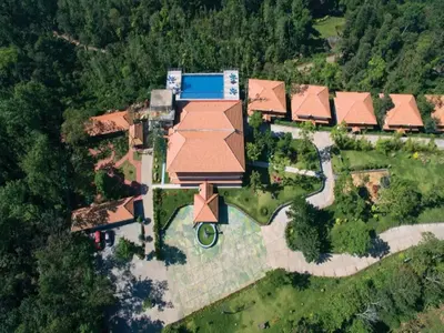 an overhead view of a house with a roof at Coorg Cliffs Resorts in Ammatti
