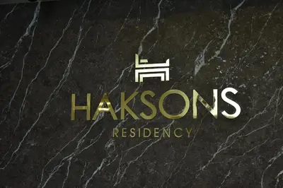 a logo for hacirosresresresociation at Haksons Residency in Mananthavady